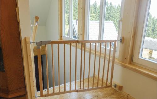 a staircase in a house with a window at Cozy Apartment In Auerbach Ot Grünheide in Grünhaide