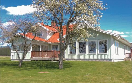 a white house with an orange roof at Beautiful Home In Vessigebro With Sauna in Vessigebro