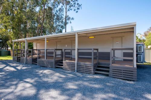 a building with a lot of stalls in a parking lot at Ingenia Holidays Lake Macquarie in Mannering Park
