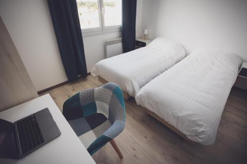 Letto o letti in una camera di La Côte de Lumière