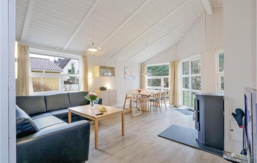 a living room with a couch and a table at Dünenpark 16 - Dorf 6 in Priwall
