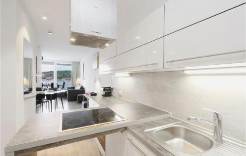 a kitchen with a sink and a counter top at Promenadenvilla in Travemünde