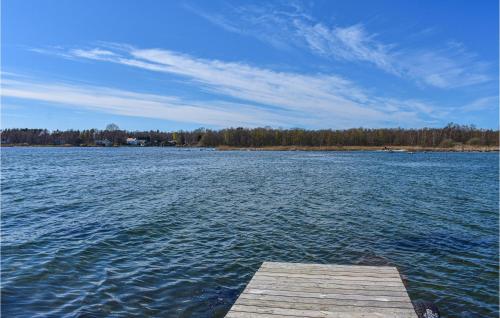 a wooden dock on a large body of water at Lovely Apartment In Listerby With Wifi in Listerby