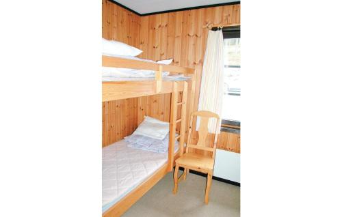 a room with two bunk beds and a chair at Amazing Home In Slen With 3 Bedrooms in Sälen