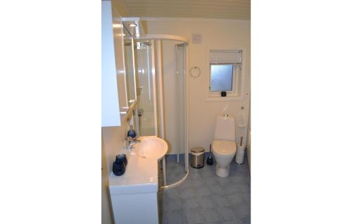 a bathroom with a shower and a sink and a toilet at Beautiful Apartment In Norheimsund With House Sea View in Norheimsund