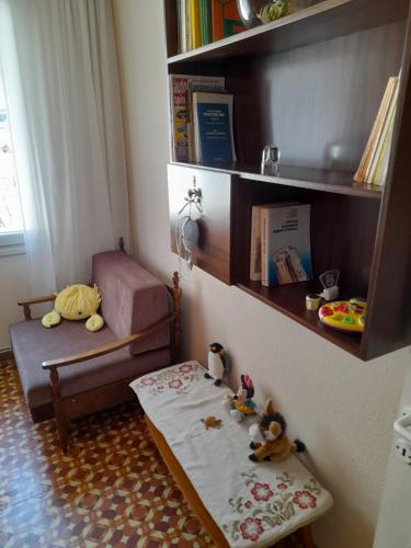 a childs room with a table and a chair and a shelf at Friendly Philoxenia in Xanthi
