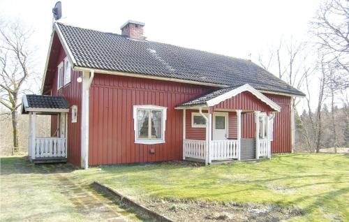 a red house with a white at Stunning Home In Östra Frölunda in Östra Frölunda