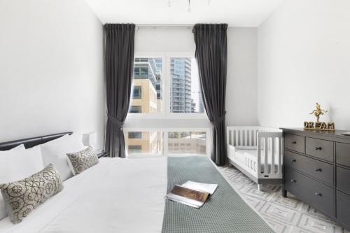 Postel nebo postele na pokoji v ubytování The Smart Concierge - Marina Sail