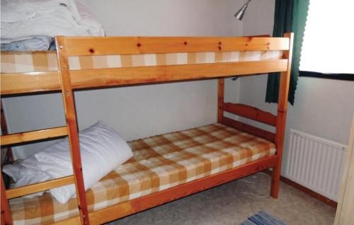 a couple of bunk beds in a room at 2 Bedroom Awesome Home In Torup in Hallaböke
