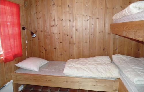 a bunk bed in a room with wooden walls at Amazing Home In Ringebu With 2 Bedrooms And Wifi in Odlo