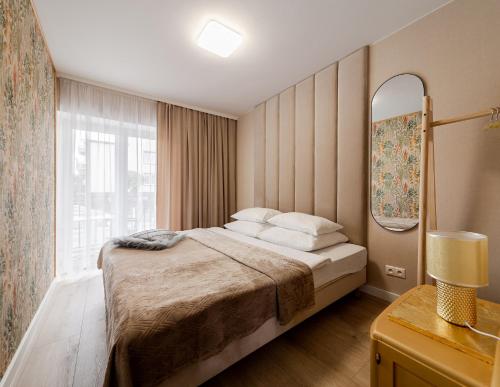 Postel nebo postele na pokoji v ubytování Pokoje Gościnne Hafen Guesthouse - Władysławowo