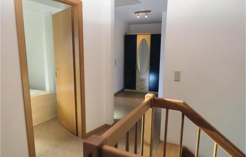 a hallway with a stairway with a urinal in a room at Two-Bedroom Holiday Home In Hachenburg in Hachenburg
