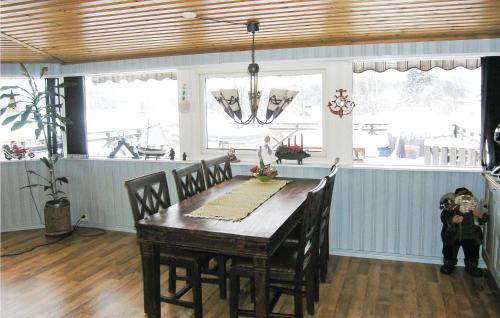 a dining room with a wooden table in a kitchen at Pet Friendly Home In Tranås With Sauna in Tranås