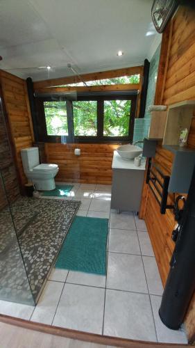 a bathroom with a toilet and a sink at Windsong Living The Nest in Krugersdorp