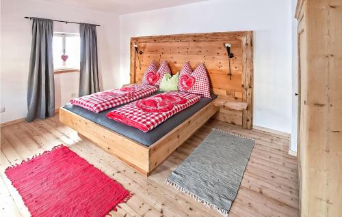 A bed or beds in a room at Awesome Home In Kolsassberg With Kitchen