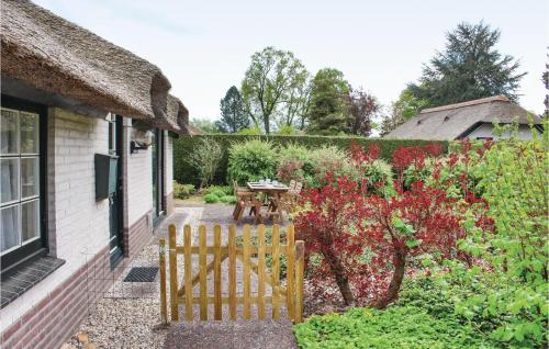 a garden with a wooden gate in front of a house at 2 Bedroom Beautiful Home In Ermelo in Ermelo