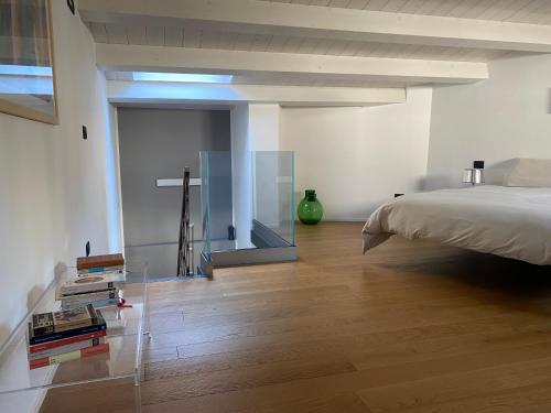 a bedroom with a bed and a glass wall at Le dimore di Palagonia in Bagheria