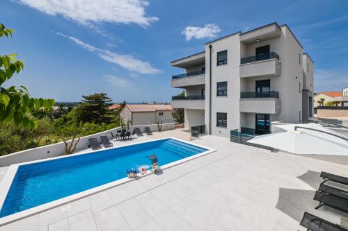 an image of a villa with a swimming pool at The Eagle in Novalja