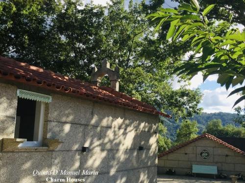 um edifício com uma cruz em cima em Amarante-Quinta D’Manuel Maria, Rural Charm Houses em Amarante