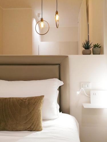 Letto o letti in una camera di Palazzo Cortesi