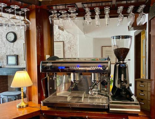 a blender sitting on top of a table with a lamp at The Gordon Arms Restaurant with Rooms in Yarrow