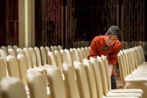 a man standing in front of rows of chairs at InterContinental Shijiazhuang by IHG in Shijiazhuang