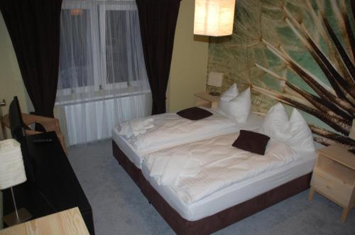 A bed or beds in a room at CASILINO Hotel A 24 Wittenburg