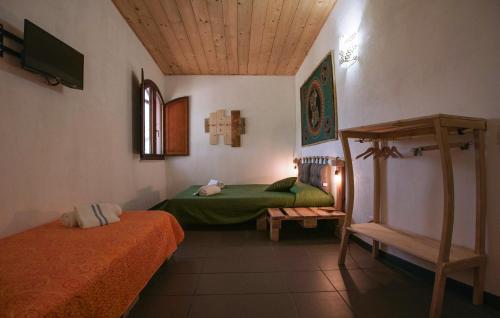 a room with two beds and a tv in it at Villa Virginia in Ragusa