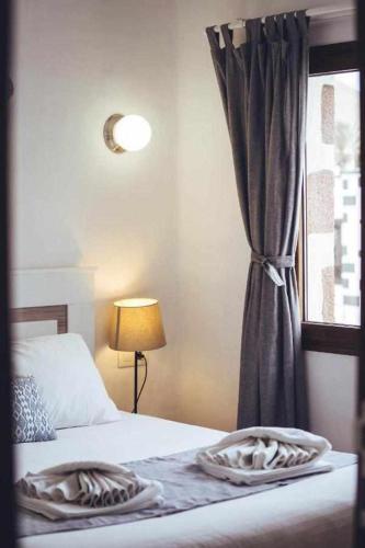 Ένα ή περισσότερα κρεβάτια σε δωμάτιο στο El Callao II Suites