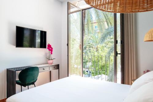 A bed or beds in a room at Casa de la Romanilla