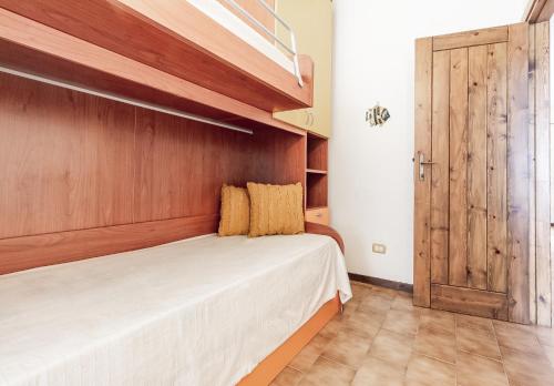 Postel nebo postele na pokoji v ubytování Relax Family House al Mare