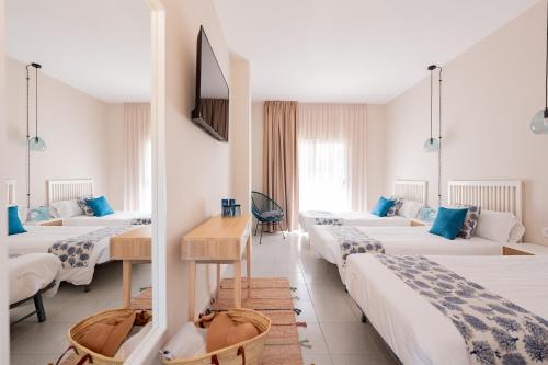 Postel nebo postele na pokoji v ubytování Hotel Aubí