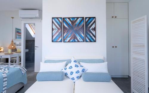 a living room with a couch and a painting on the wall at NEW! ReLux - ZF Hvar in Hvar