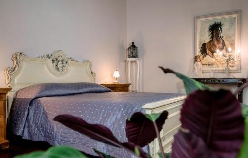 Ένα ή περισσότερα κρεβάτια σε δωμάτιο στο PALAZZO Bed and Breakfast