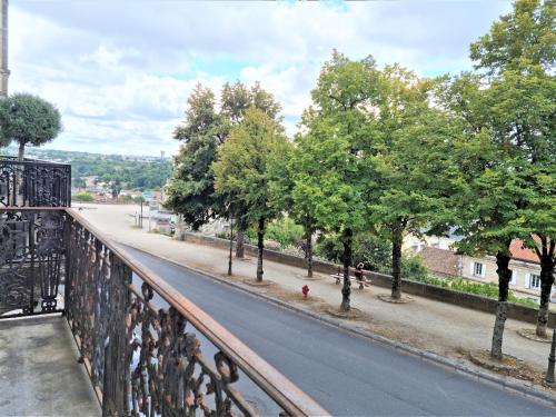 a view from a balcony of a street with trees at Maison spacieuse avec balcon sur les remparts in Angoulême