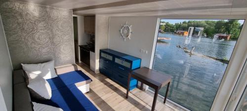 Postel nebo postele na pokoji v ubytování Hausboat Vlnka