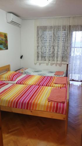Voodi või voodid majutusasutuse Vila Mitko toas