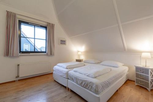 Postel nebo postele na pokoji v ubytování Buitenplaats 62 Callantsoog