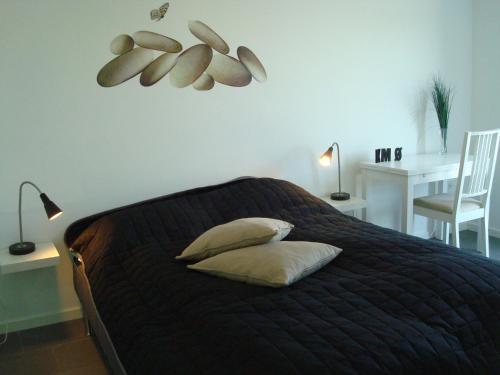 En eller flere senge i et værelse på Slettestrandvej Apartment - Slettestrandvej 130 nr. 5 - ID 625