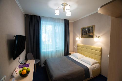 מיטה או מיטות בחדר ב-Grand Christer Hotel