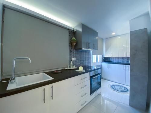 A kitchen or kitchenette at Camara Suite