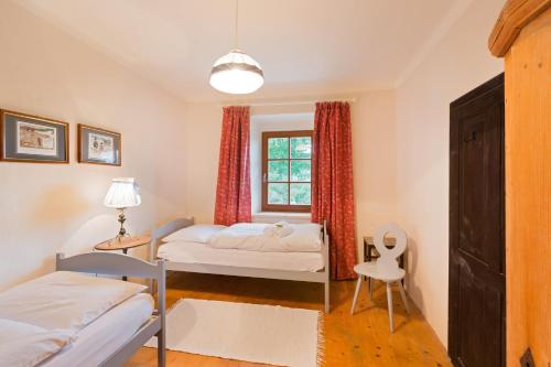 Un pat sau paturi într-o cameră la Gärtnerhaus