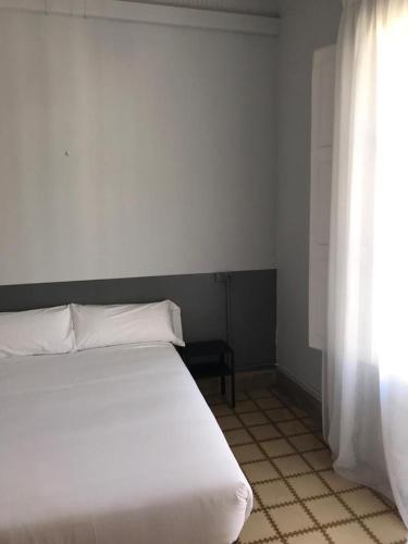 Postel nebo postele na pokoji v ubytování Hotel Monegal