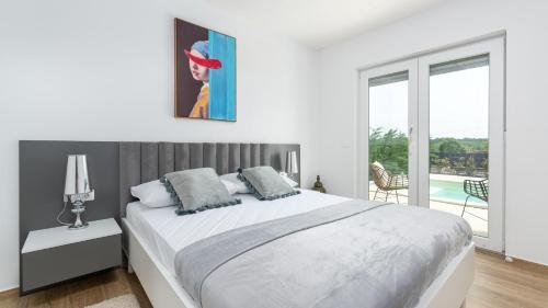 Posteľ alebo postele v izbe v ubytovaní Villa Audrey