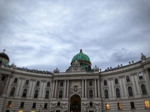 a building with a green dome on top of it at Hotel Pension ARPI in Vienna