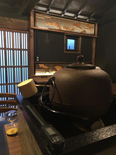 a suitcase sitting on a counter in a room at Tomo's INN - priceless experience - in Obu