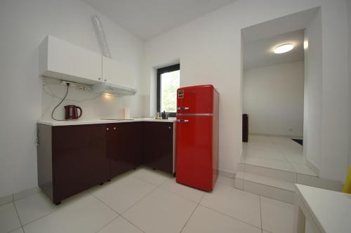 A kitchen or kitchenette at Comfort Apartments Korzeniowskiego