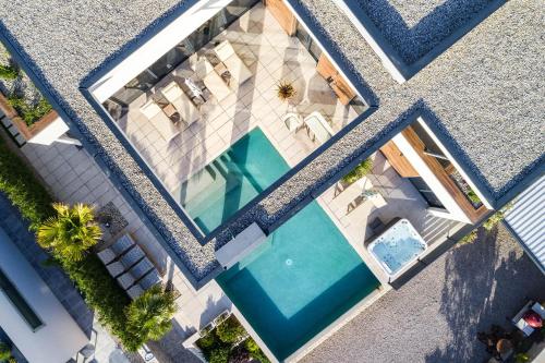 an overhead view of a swimming pool in a house at FIRST RESIDENCE Villa Eternity in Linardići