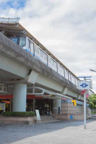 a train on a bridge over a building at Corner Hostel & Cafe in Taipei