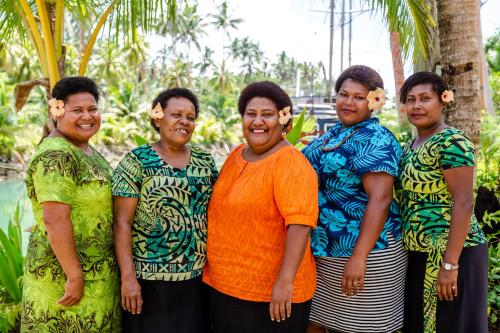 a group of women posing for a picture at Savasi Island Resort in Savusavu